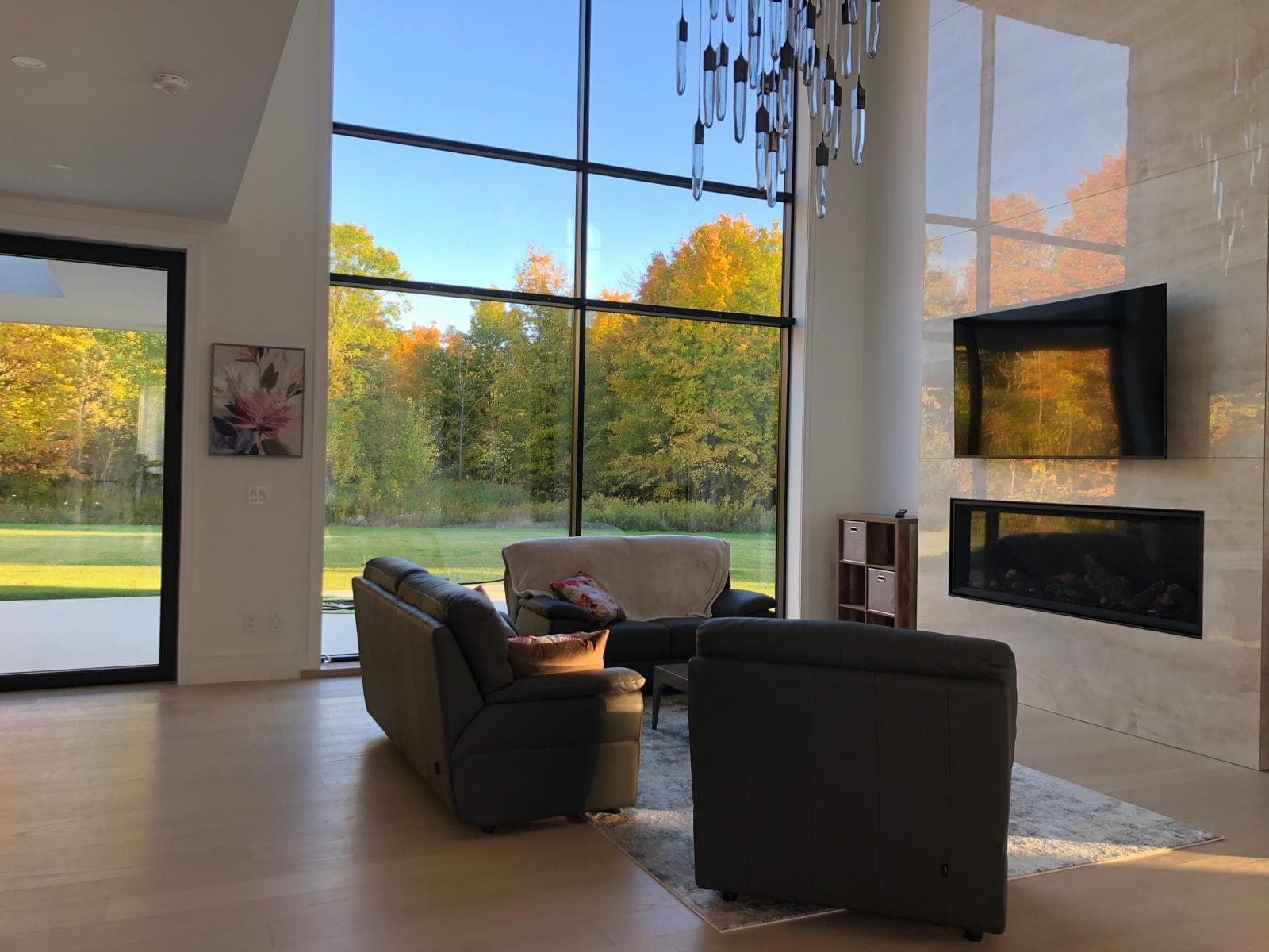 Sunlit modern home with crystal-clear floor-to-ceiling windows